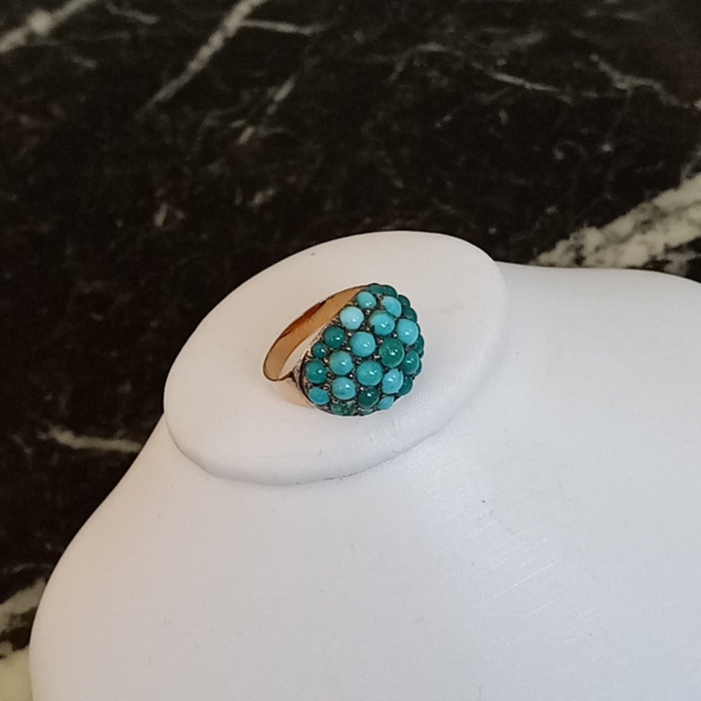 Antique beautiful turquoise more than 100 years old on a gold ring.